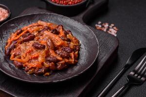 Vegan or vegetarian stew with red beans, onions and carrots or lobio photo
