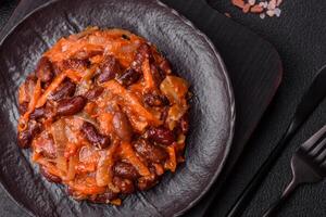 Vegan or vegetarian stew with red beans, onions and carrots or lobio photo