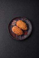 Delicious fresh cutlet or meatball Kiev style with filling photo