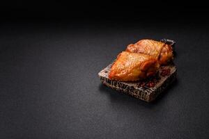 Chicken thighs fried with salt, spices and herbs photo