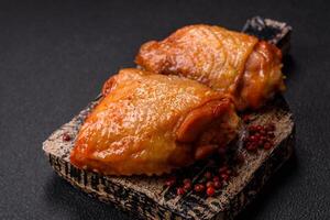 Chicken thighs fried with salt, spices and herbs photo