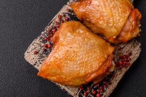 Chicken thighs fried with salt, spices and herbs photo