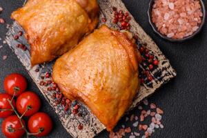 Chicken thighs fried with salt, spices and herbs photo
