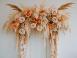 Peach roses and pampas grass arch. photo