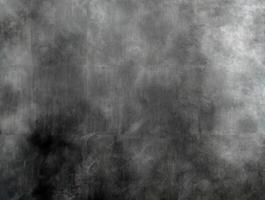 Moody dark gray textured background featuring soft cloudy and grunge patterns, suitable for creative and design purposes. photo