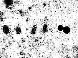 Abstract grunge texture with a rough pattern of black speckles on a white background. photo