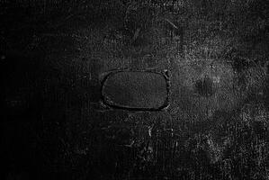 Abstract black textured surface with subtle highlights, perfect as a background or design element. photo