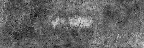 Dark gray cracked concrete surface with grunge texture, perfect for background or industrial design elements. photo