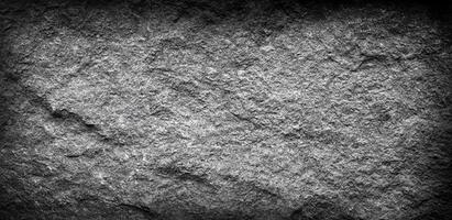 Grainy stone surface with a rugged texture, perfect for backgrounds, overlays, or industrial design projects. photo