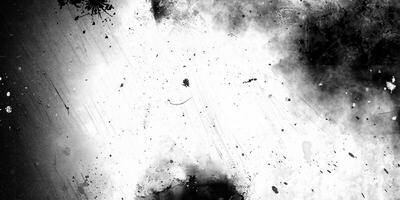 High-contrast abstract texture in black and white, featuring grunge splatter, scratches, and a weathered aesthetic. photo