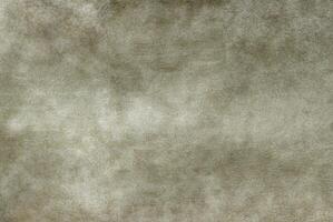 Soft gray-beige texture with a subtle grain and cloudy gradient, perfect for design backgrounds or creative projects. photo