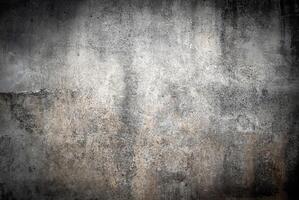 Detailed texture of a weathered concrete wall featuring a grunge-style pattern with subtle shades of gray and beige. photo