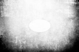 Distressed black and white background with grunge texture, scratches, and faded edges. Ideal for artistic, vintage, or abstract design projects. photo