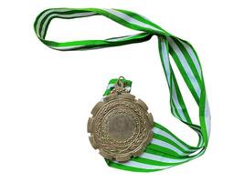 A green and white ribbon with a medal on it photo