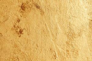 Abstract grunge golden background, vintage rough texture. Yellow design background. photo
