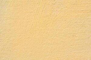 Texture of yellow stucco for modern interior. Abstract pink background. photo