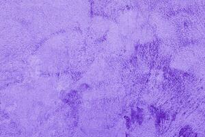 Texture of rough violet plaster. Architectural abstract background. photo