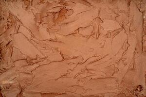 Chocolate ice cream texture. Top view. Delicious cool treat. photo