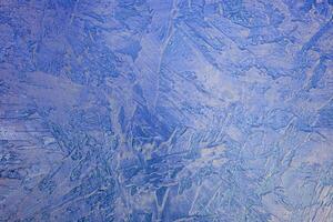 Texture of blue plaster. Rough wall of the building. photo