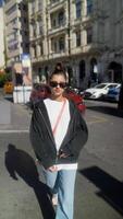 Enjoying a Casual Street Style Look While Embracing the Urban Environment Around Us video