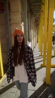 A Stylish Person Posing in an Urban Setting While Wearing a Trendy Casual Outfit and Beanie video