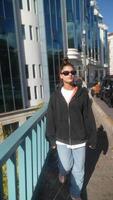 Enjoying a casual and leisurely walk in an urban setting on a bright, sunny day video