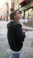 A young woman joyously exploring a quaint and charming street filled with vibrant culture and life, video