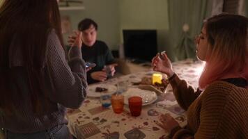 An Evening Conversation Happening Among Friends Gathered at a Cozy, Inviting Table video