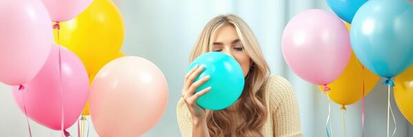 Woman enjoying a colorful celebration with balloons in a bright and cheerful atmosphere photo