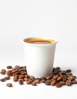 Freshly brewed coffee in a white cup surrounded by roasted beans on a simple background photo