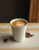 Enjoying a freshly brewed coffee with latte art in a cozy setting photo