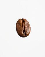 Coffee bean resting on a white surface showcasing its rich color and texture in a minimalistic style photo