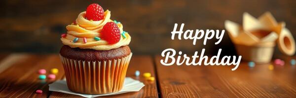 Celebratory birthday cupcake decorated with frosting, berries, and sprinkles on a wooden table photo