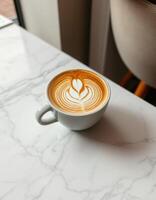 Warm latte art in a cozy cafe on a marble table captured during a quiet morning photo
