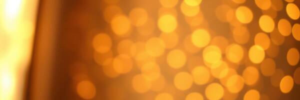 Warm golden bokeh lights create a cozy atmosphere during a festive evening celebration photo