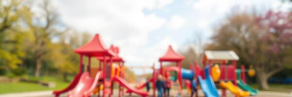 Colorful playground filled with children playing on sunny day in community park photo