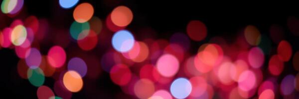 Colorful bokeh lights create a festive atmosphere during a nighttime celebration in the city photo
