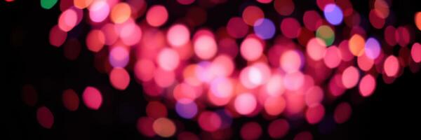 Colorful bokeh lights create a festive atmosphere during a vibrant celebration at night photo