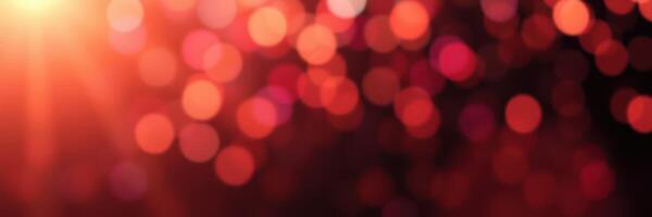 Vibrant red bokeh lights create a warm atmosphere in a festive evening setting filled with celebration and joy photo