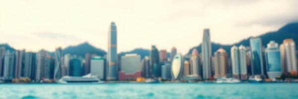City skyline along the waterfront with tall buildings and mountains in the background during a cloudy day photo