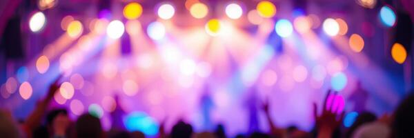 Colorful stage lights illuminate a lively concert atmosphere during a music festival evening in late summer photo