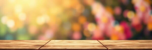 Wooden table surface set against a colorful blurred backdrop with bright sunlight filters near a garden at sunset photo