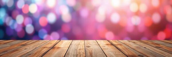 Colorful bokeh background with wooden table surface for creative display or product presentation photo