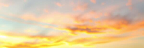 Vibrant sunset paints the sky with hues of orange and pink over a tranquil landscape during late evening hours photo