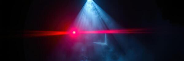 Colorful light beams create a captivating atmosphere in a dark setting during a late-night event photo