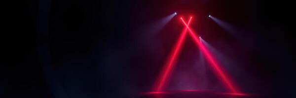 Vibrant red laser lights create a captivating atmosphere at a live music event in the evening photo