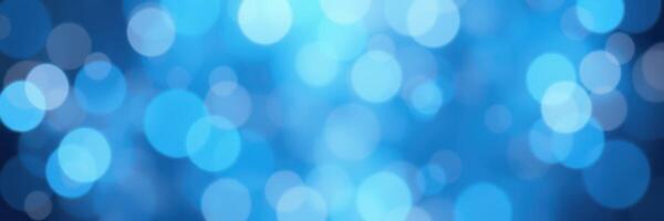 Beautiful blue bokeh background with soft, blurred circles creating a calming atmosphere for design projects photo