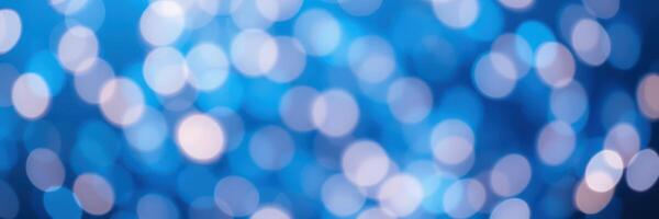 Soft blue bokeh lights create a dreamy atmosphere during an evening celebration in a cozy indoor space photo