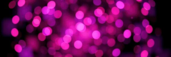 Colorful bokeh effect lighting in shades of pink creating a vibrant and festive atmosphere for celebrations photo