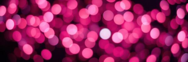 Vibrant pink lights create a festive atmosphere during a nighttime celebration at an outdoor event photo